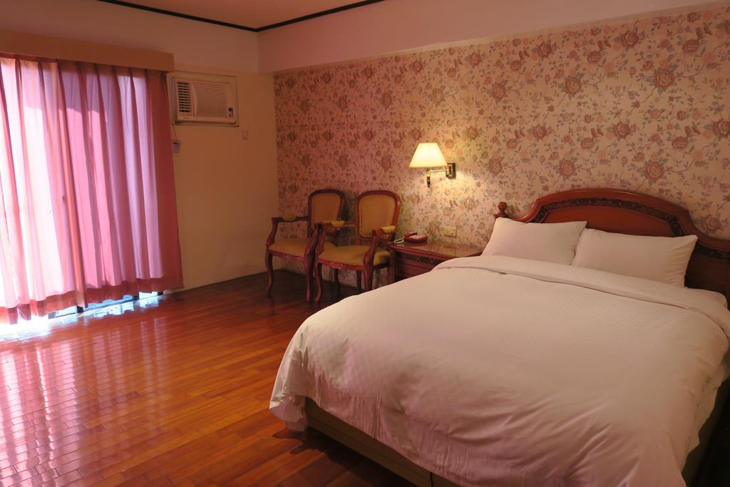 Champagne Hotel Jiaoxi Habitación foto