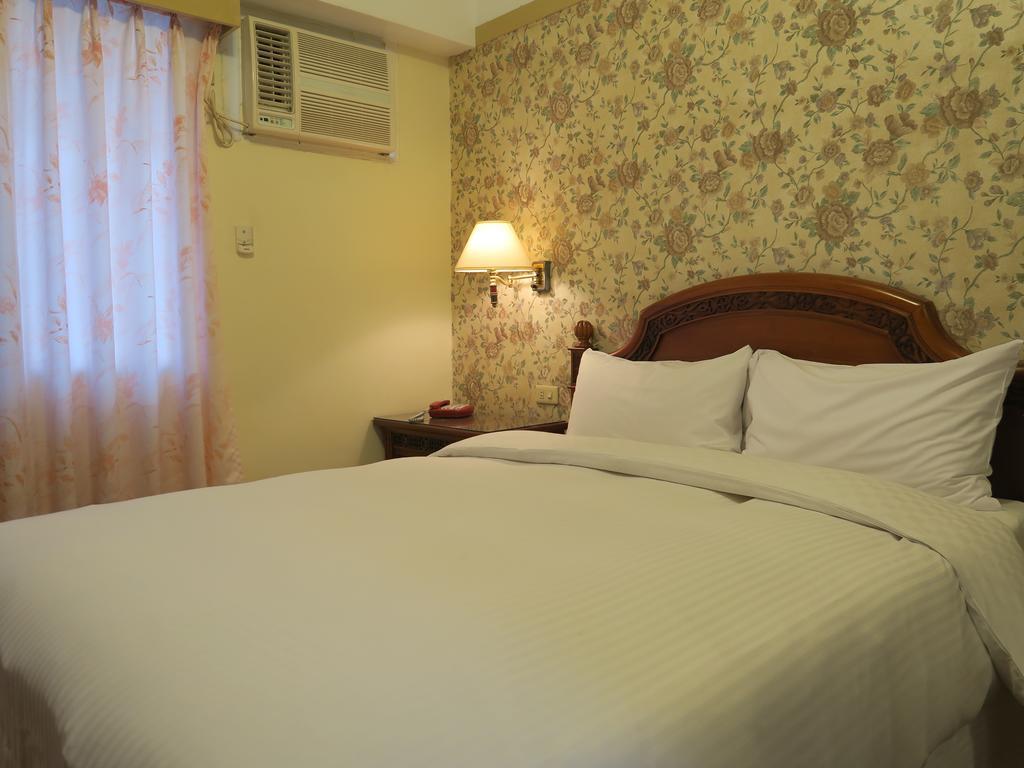 Champagne Hotel Jiaoxi Habitación foto